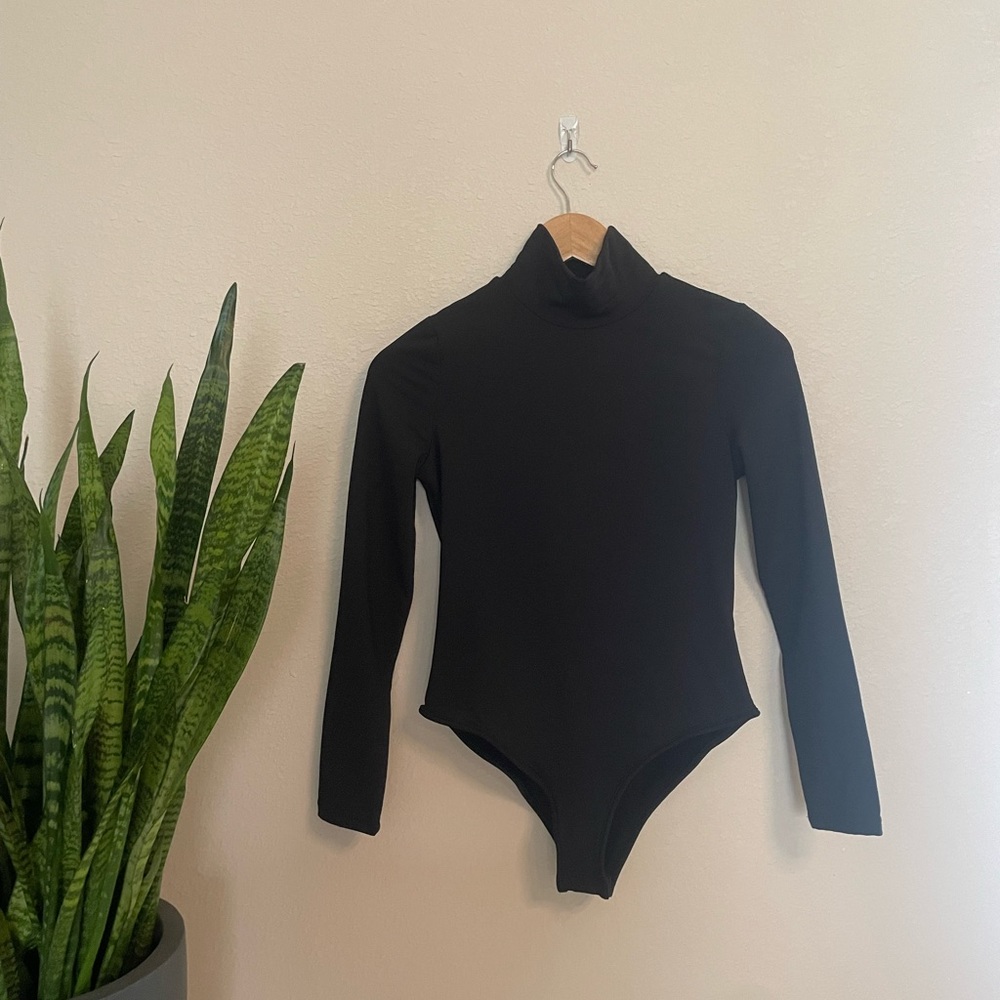 Black turtleneck bodysuit